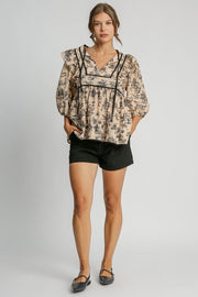 Umgee Ruffled Tie Neck Puff Sleeve Babydoll Blouse